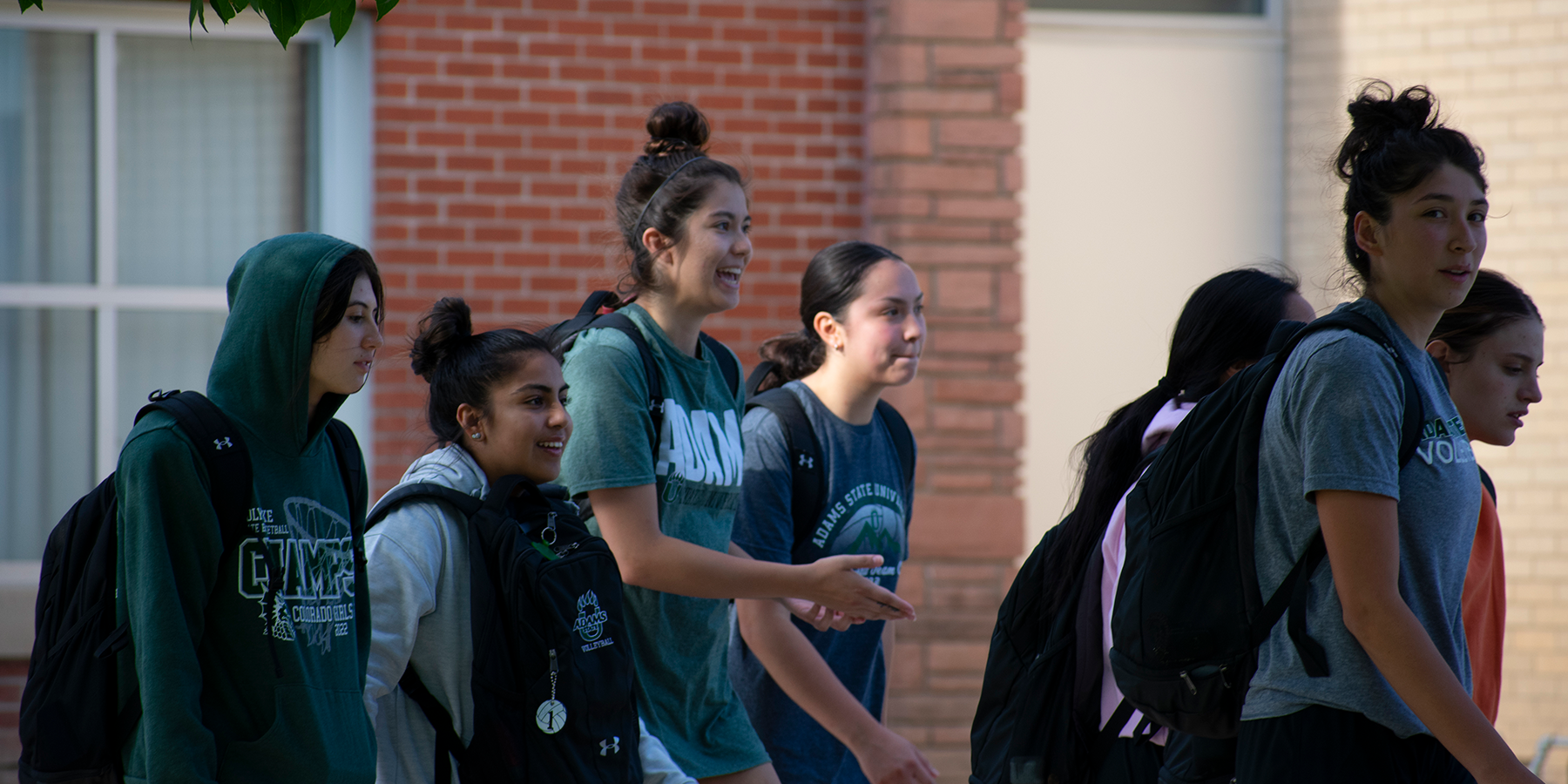 students walking outside on campus