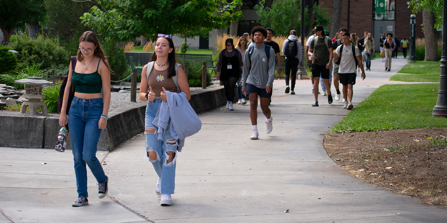 students walking on campus outside