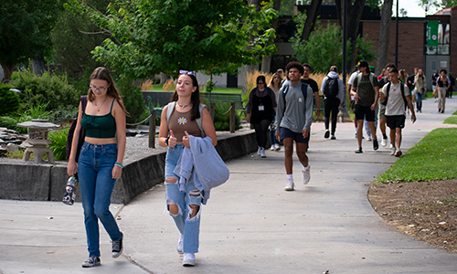 students walking on campus outside