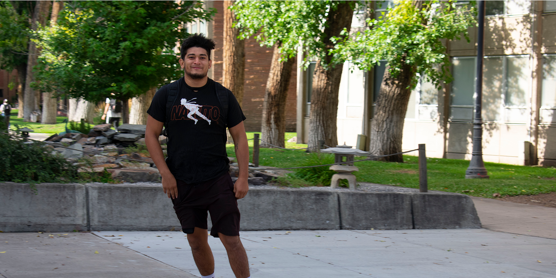 student skateboarding on campus